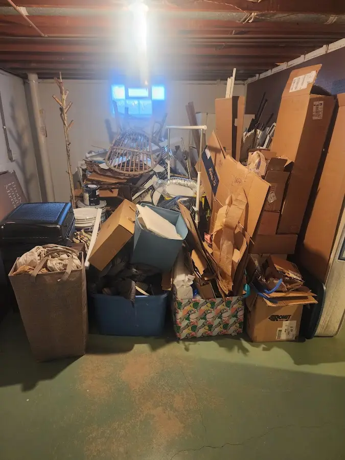 Roll-off dumpster container at job site for Yard Waste Dumpster Rental in Rumford